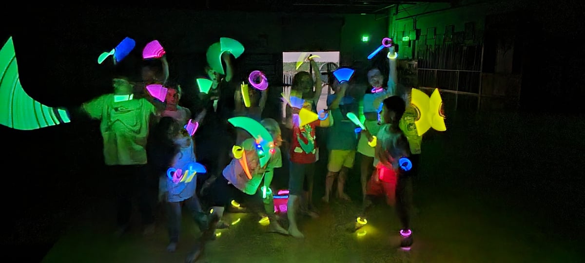 kids playing with glow sticks