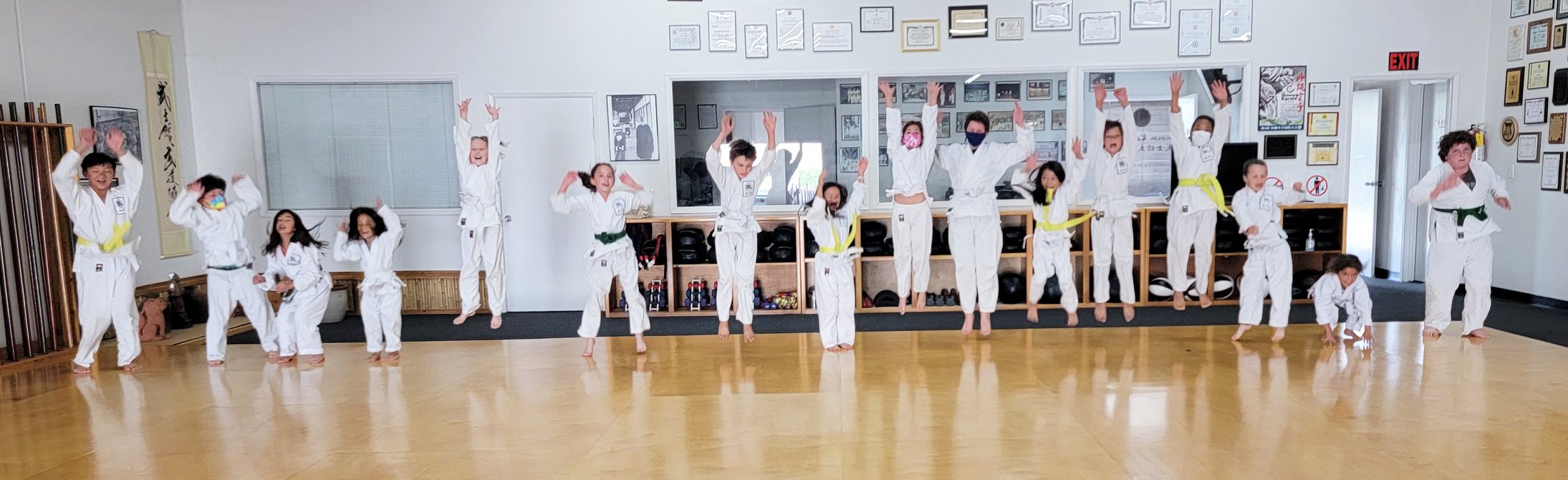 a group of kids jumping in the air smiling